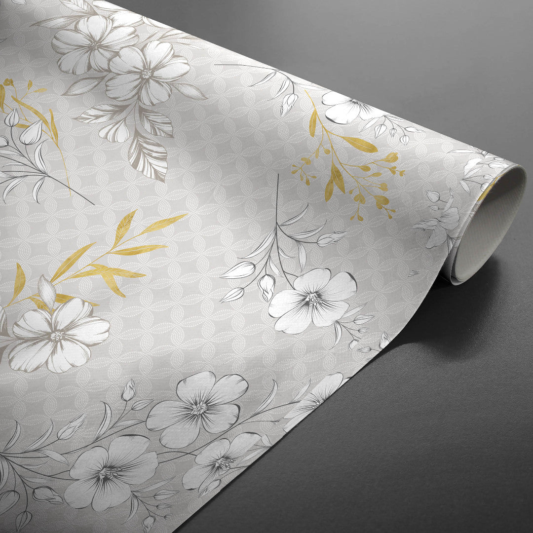 Hortense - Vaxduk med blommor i gyllene och neutrala toner, ihoprullad