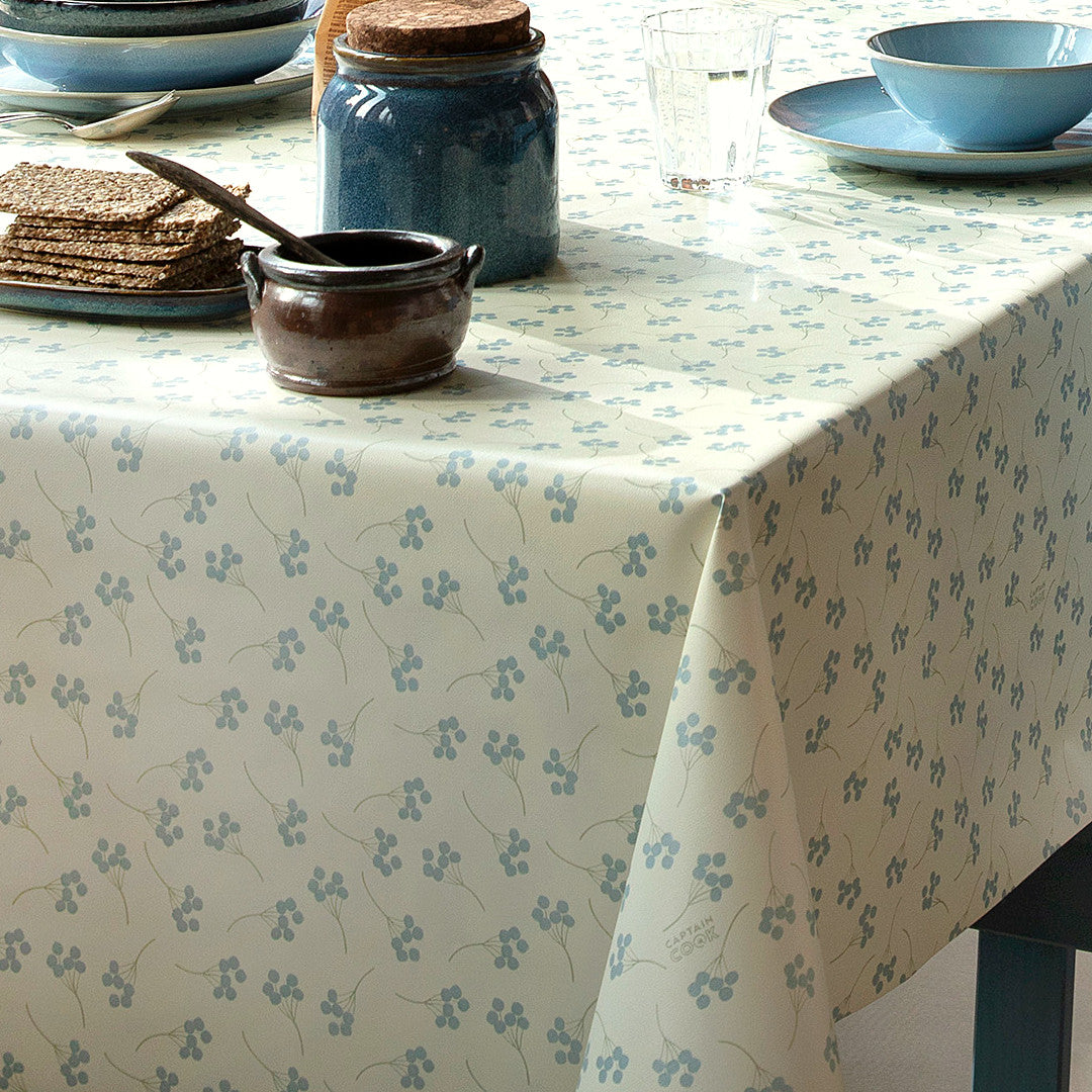 Mimosi North – Captain Cook vaxduk med små grafiska blommor hörn