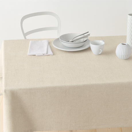 Nordfavn Dean Natur – Enfärgad textilvaxduk i linnelook, på bord