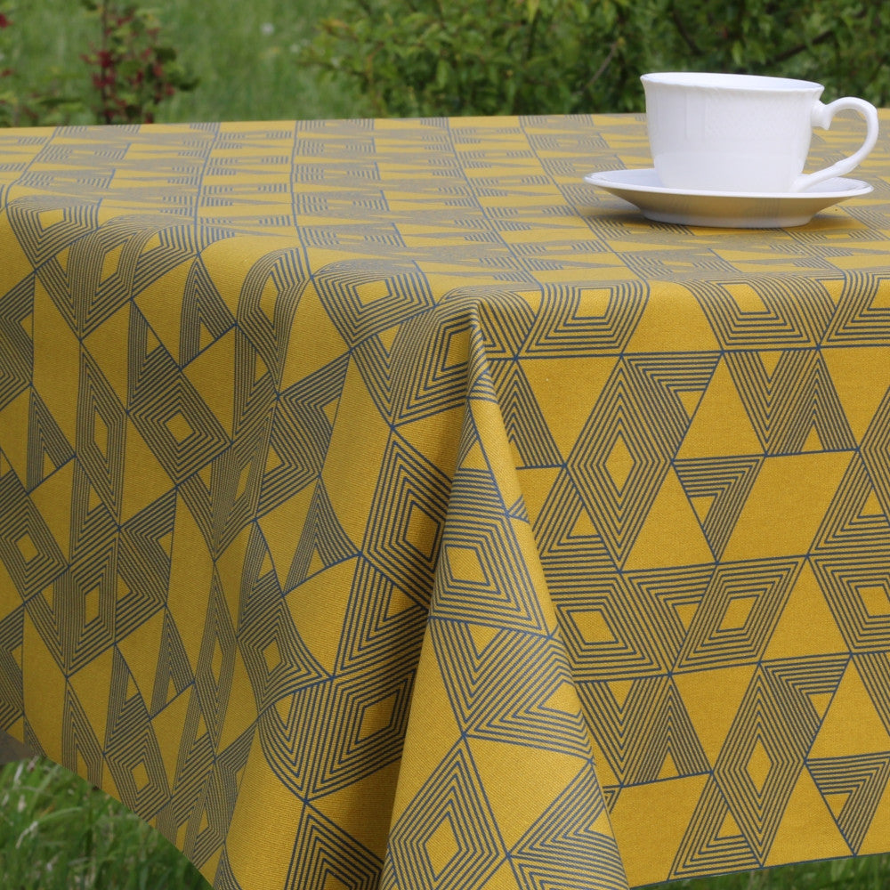 Cuzco Curry-gul/blå, textilvaxduk med grafiskt mönster - 140 cm bred