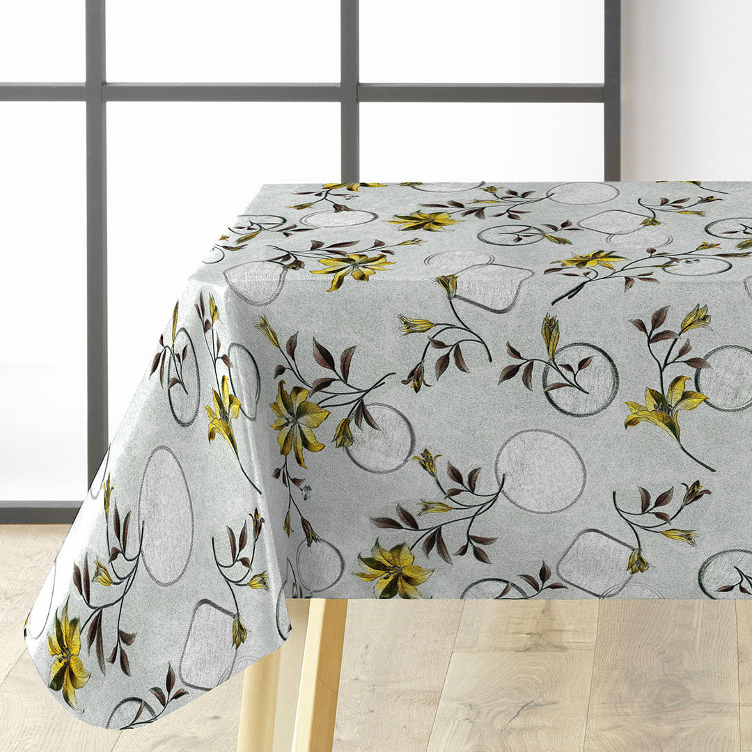 Närbild av Altea Metallic Yellow vaxduk med gyllene julstjärnor