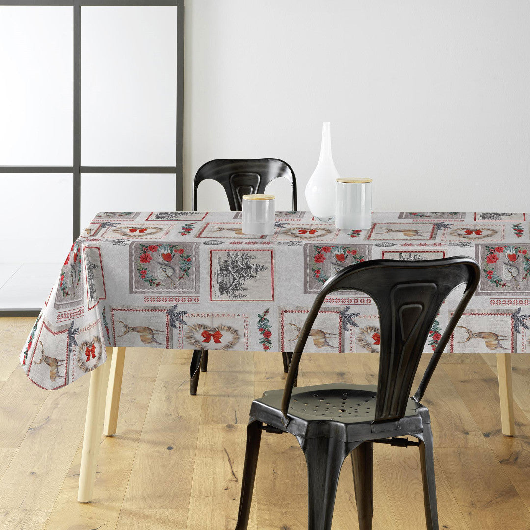 Julvaxduk med vintermotiv i en trevlig dukning