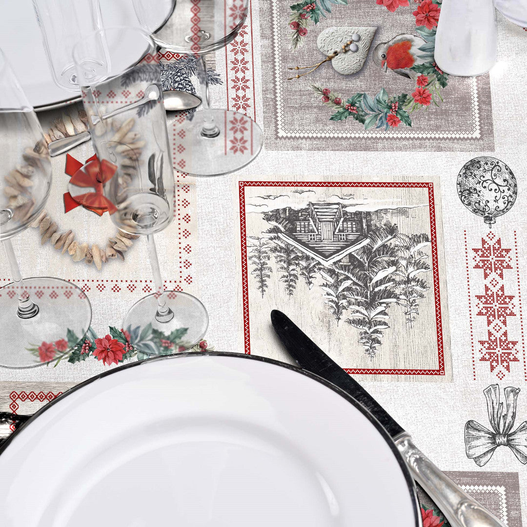 Närbild av dukningen på julvaxdukenmed motiv från bergener