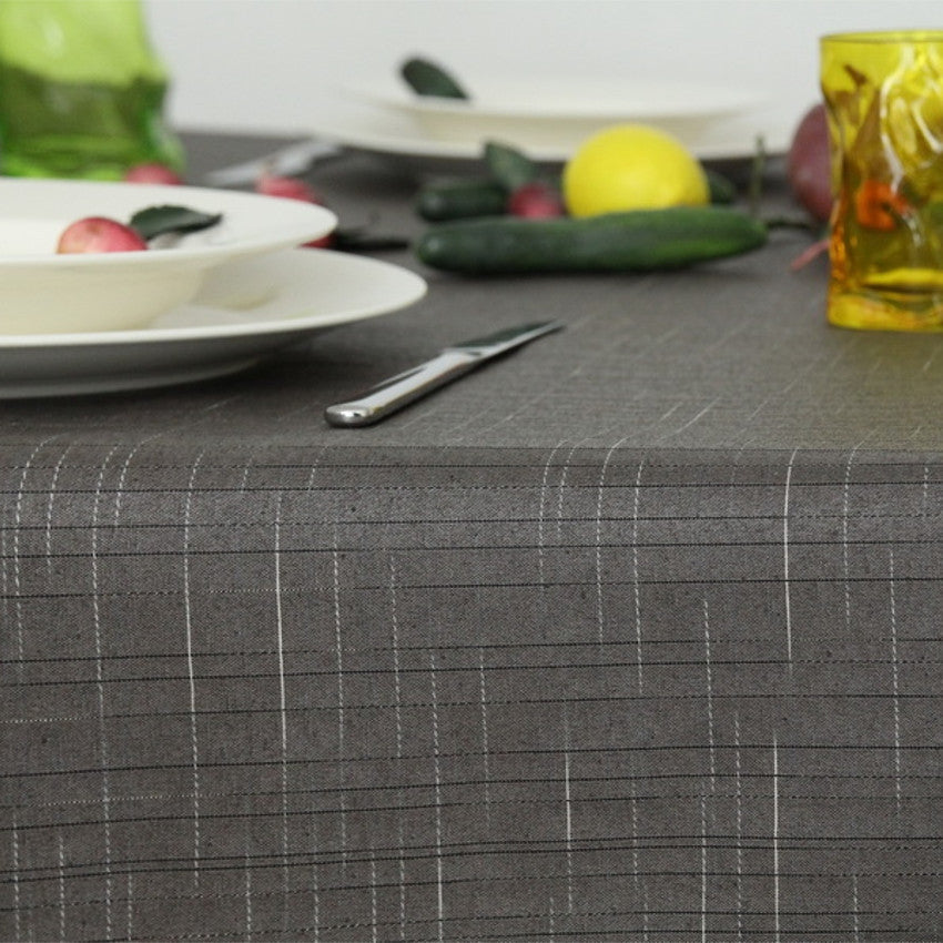 Damero Liso textilvaxduk i grå, 140 cm bred