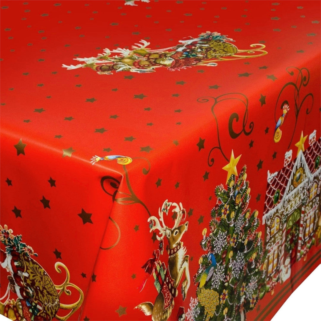 Närbild av hörnet på Jul i Kagehuset vaxduk med pepparkakshus och stjärna