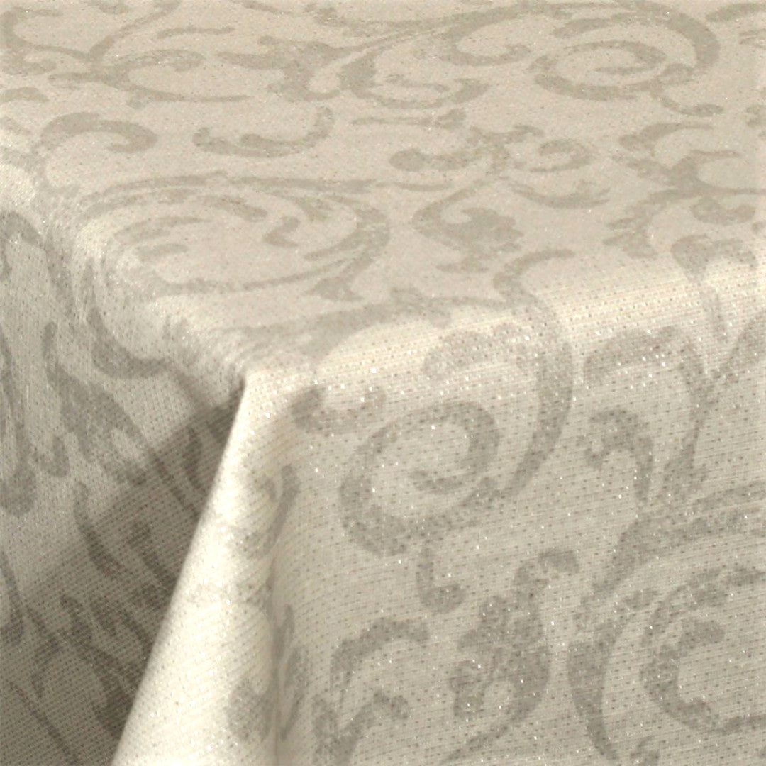 Närbild av julduk Vackra Snirklar – Textilvaxduk med silverlurex