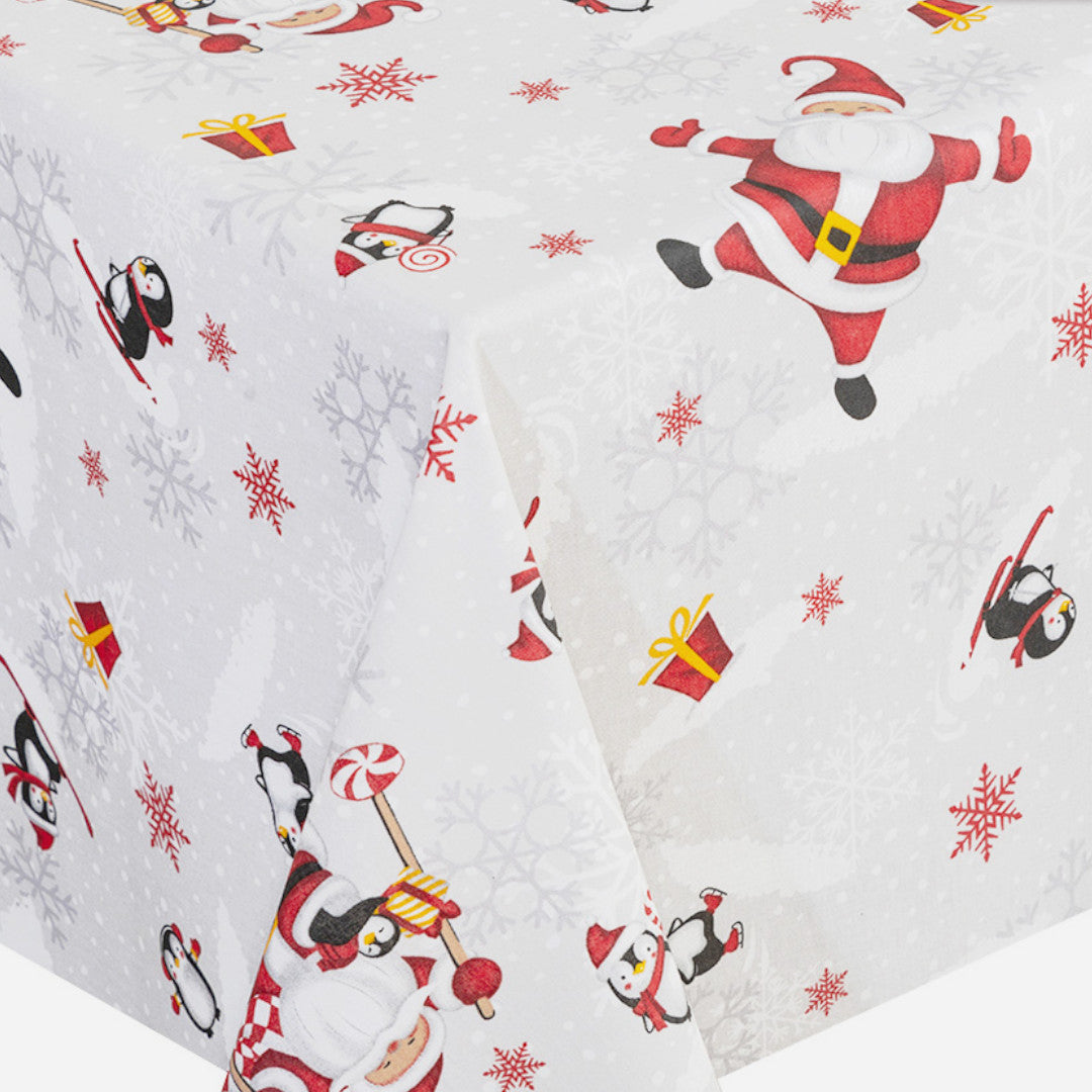 Hörnet på duken Julfest på Sydpolen – med glada tomtar och stjärnor