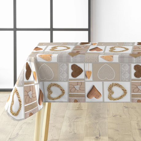 Julvaxduk med hjärtan och mönster i naturfärger på bordet