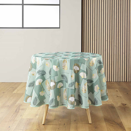 Natane Sage rund duk med bladmönster i guld och grått på en ljus bakgrund