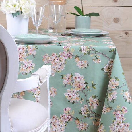 Prunus Green - vacker textilvaxduk med gröna grenar och ljusa blommor