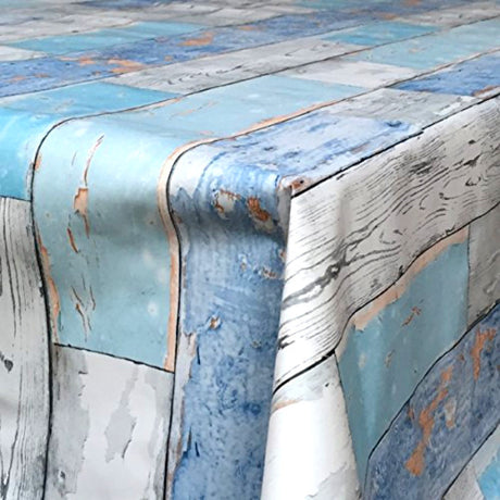 På bordet Scrap Wood, vaxduk med trälook, blå/grå