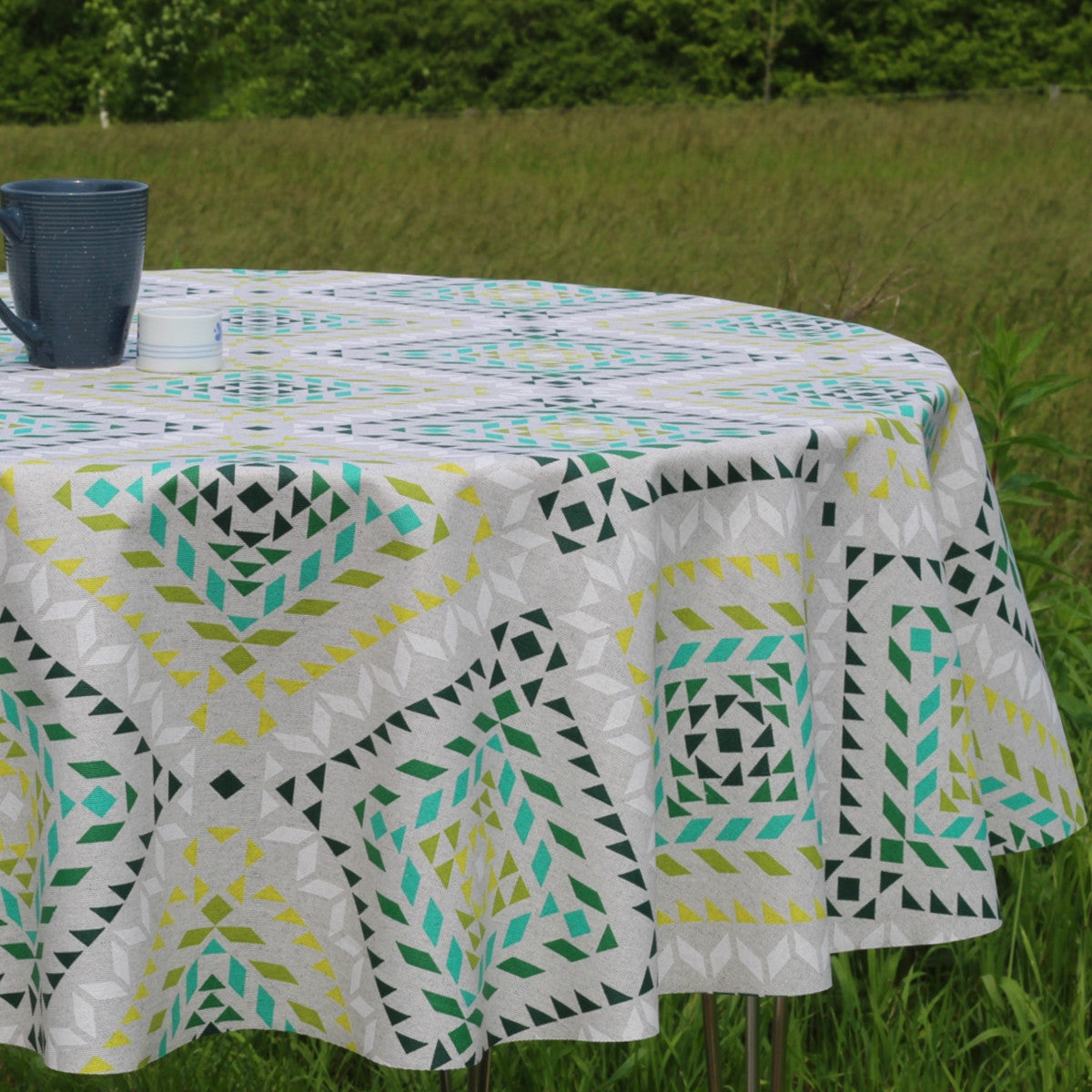 Smalts Grafiska Stjärnor - grön, Laura Lancelle textilvaxduk - 150 cm bred