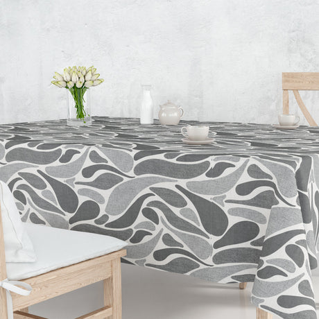 På bordet Stone Grey Wave - Vaxduk med böljande mönster i grå nyanser