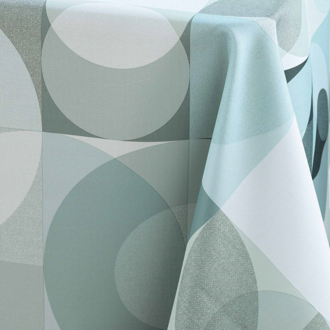 Närbild av Tessouro Sage-dukens textur och cirkulära mönster i lugna gröna toner