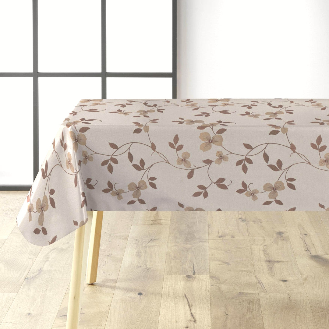 På bordet Ljus beige vaxduk med blomsterrankor