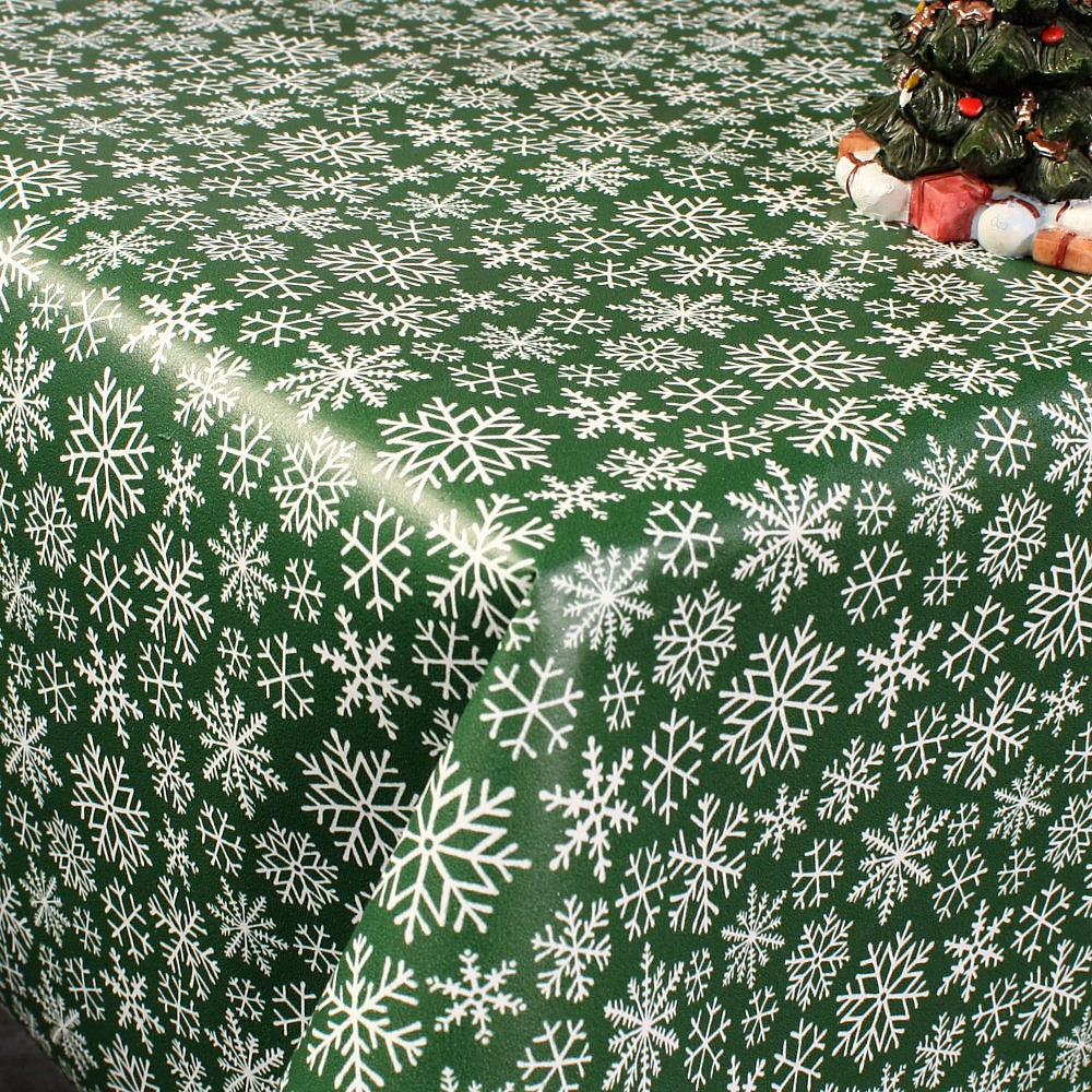 Trend Julduk - Snöflingor på en mörkgrön bakgrund