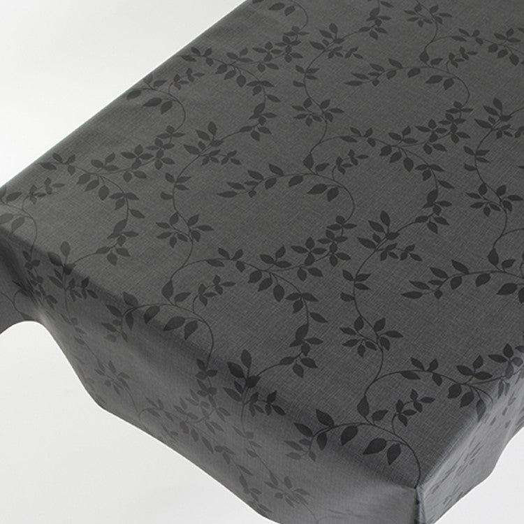 På bordet Vaxduk Linette, linne-look med blad i antracit, 140 cm bred