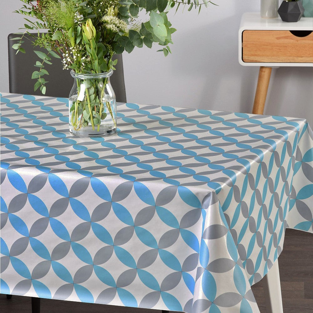 På bordet Luna Blå - Vit vaxduk med retro cirkelmönster