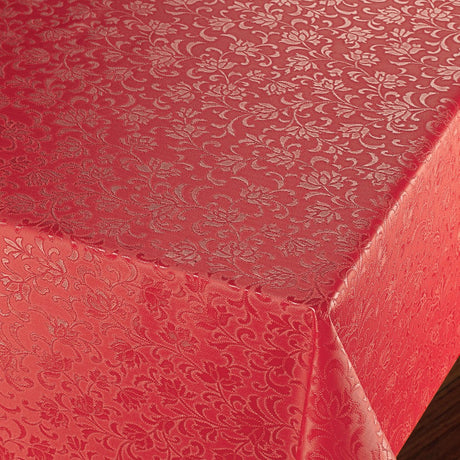 Rosenflor Röd - Vacker damastpräglad vaxduk. På bordet, hörn bild