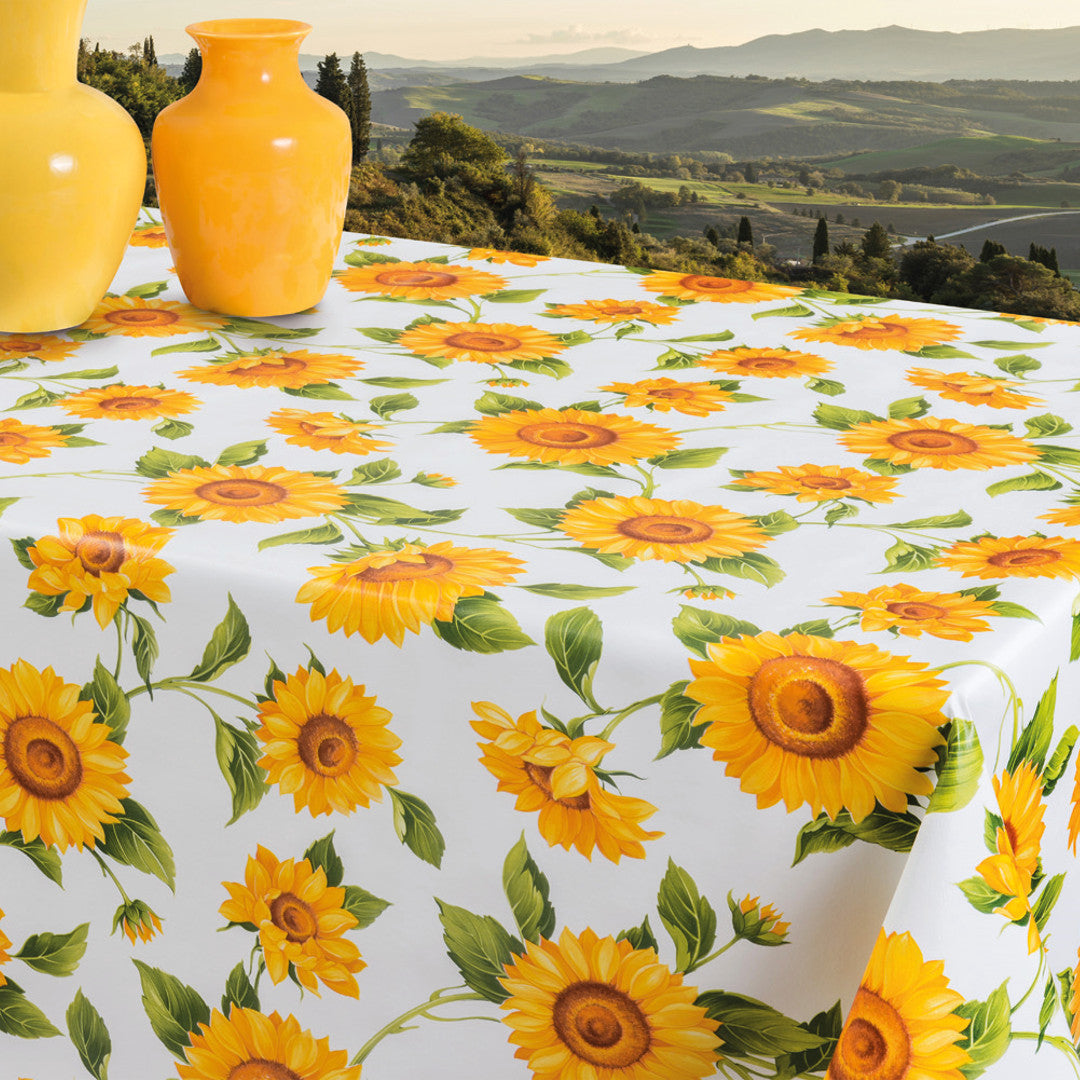 Solrosor- Vaxduk i gula och orange färger på vit botten, 140 cm på bordet