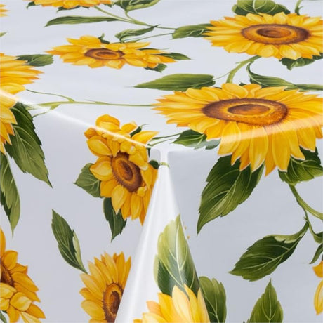 Solrosor - Vaxduk i gula och orange färger på vit botten, 140 cm