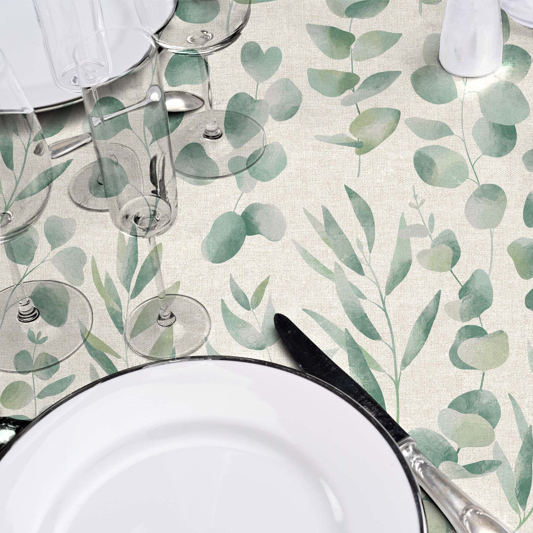 Jodie – Vaxduk med slät linnelook och grönt bladmönster, närbild
