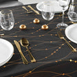Firmament Metallic Print Svart/guld - Svart nyårs-/julduk med guldtryck, 140 x 240 cm, närbild