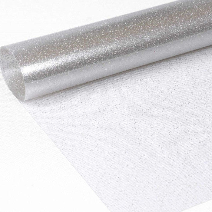 Klar plast med silver glitter. Genomskinlig vaxduk