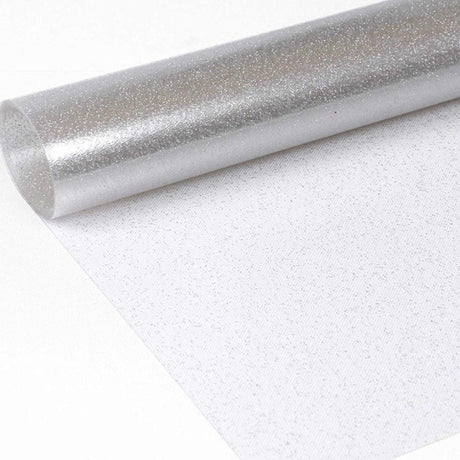 Klar plast med silver glitter. Genomskinlig vaxduk