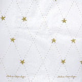 Medusa Stardust gold textilvaxduk med glidskydd, elegant julduk med guldfärgade stjärnor, 140 cm bred