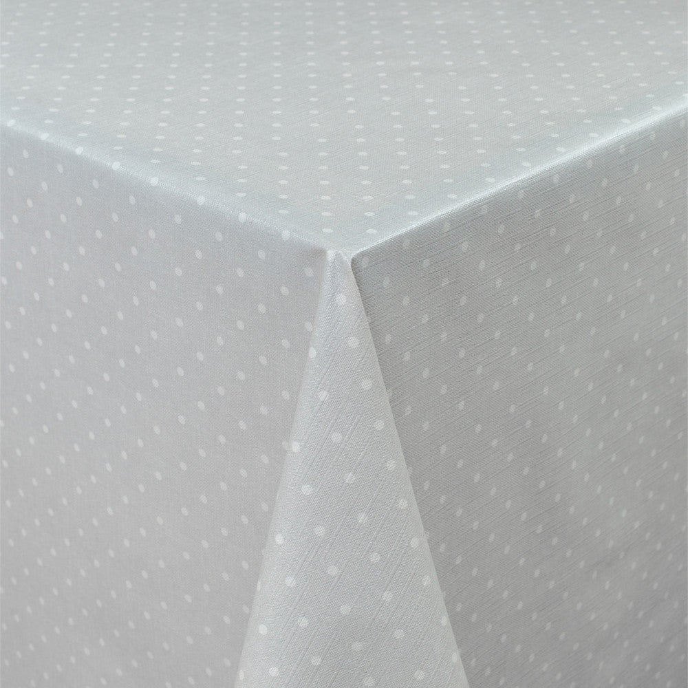 Vaxduk med polkaprickar på grå botten och lätt präglad yta