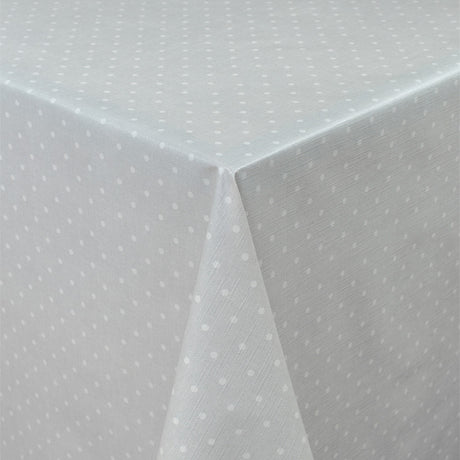 Vaxduk med polkaprickar på grå botten och lätt präglad yta